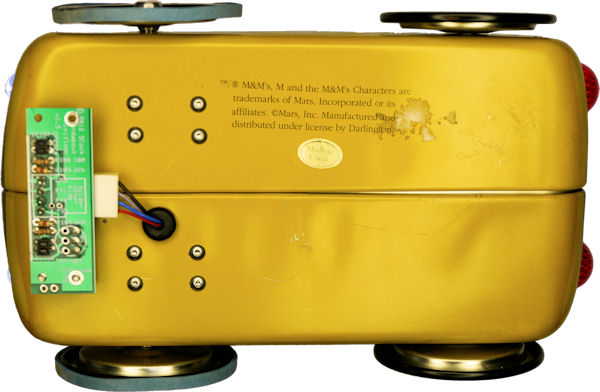 Underneath robot showing motor mounting screws and line-following board