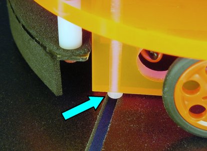 A standard socket cap screw head catches on the gap between the tiles in the ChiBots robot line-following course.