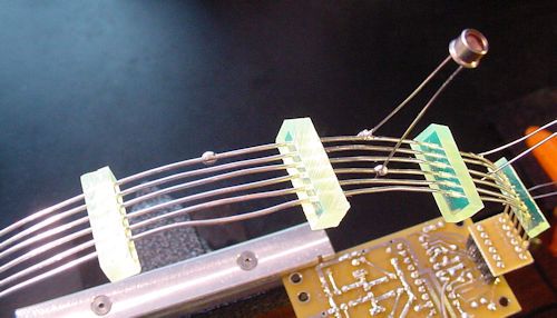 Wires through acrylic guides with photosensor soldered on