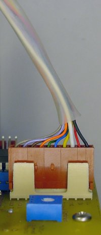 Clear shrink-wrap tubing encloses many wires.