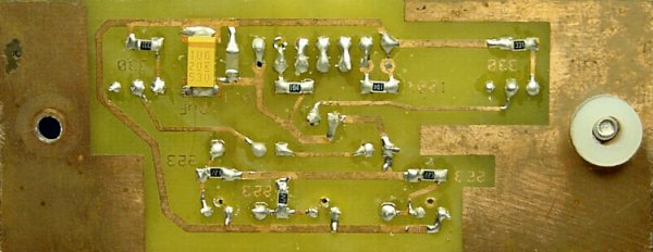 Floor-sensor board underside contains SMT components and washers.