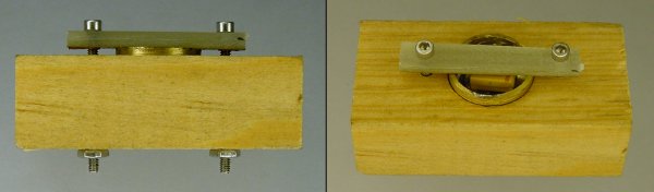 A wood fixture with a PCB plank holds a difficult-to-solder workpiece in place.