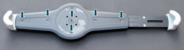 Screws underneath rubber pads