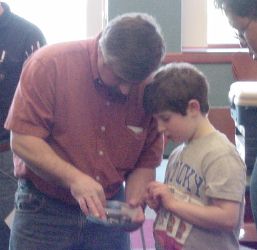 Future robot builder examining sample servos