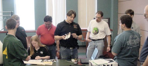 Crowd gathers for inspection