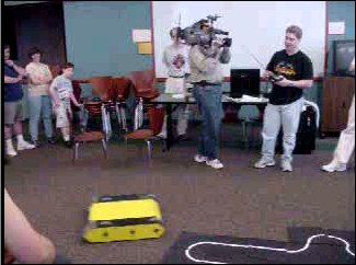 Click to see a movie of John driving his robot for the local news