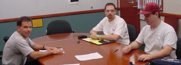 Left to right: Lee, Dave, and John. Behind the camera: David.