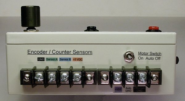 Rear panel of the electronic counter with a motor control switch. sensor connectors, and motor connectors.