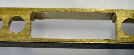 Brass face plate with unfinished slot.