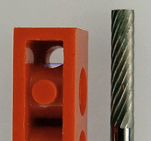 Removing an arc from the internal tube using a tungsten-carbide cutter bit.