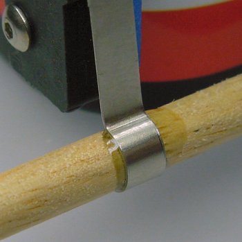 Excess epoxy securely holds wooden-rod bumper.