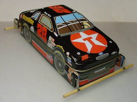 Flip-flop robot inside of a candy-tin car.