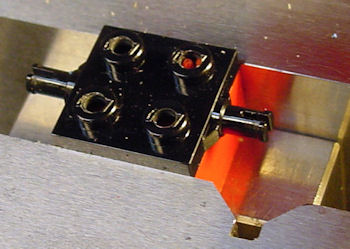 Lego wheel plate with studs drilled for 2 56 screws