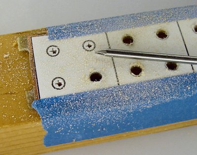 Nail prick helps drill center.