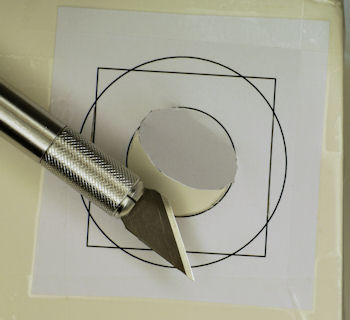 Cutting shape in foam board using paper stencil