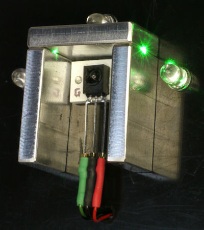 Green laser shows light leakage in aluminum baffle