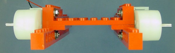 A pair of Solarbotics GM7 gearmotors attached to Lego bricks to make a robot frame.