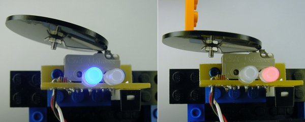 A blue LED indicates the robot is functioning. But, when the target is pressed, a red LED indicates that the robot has been disabled.