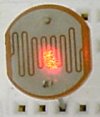 A photoresistor with a laser aimed at it