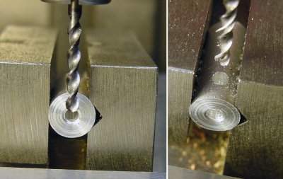 Lining up a drill over a center hole in a rod in a v-groove in a machining vise.