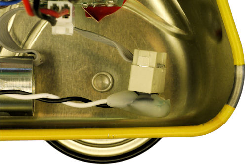 Motor connector adapter plugged together inside a metal body with nearby circuit boards