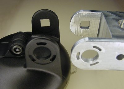 Square hole and arcs in satellite radio bracket