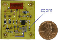 Old home etched PCB with a penny life size