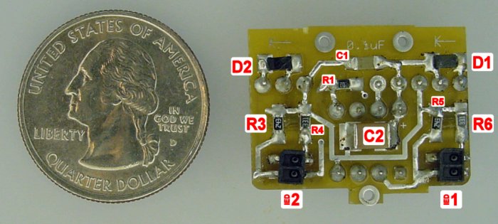 Underneath the Monkey Mints robot circuit board showing resistors, capacitors, diodes, and sensors.
