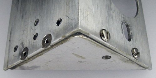 A brace is both epoxied and screwed onto an angle stock bracket.