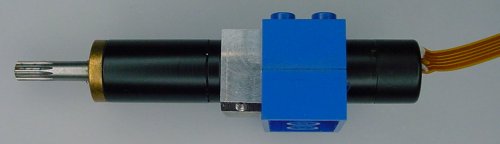 Maxon motor between two LEGO bricks with aluminum bracket to attach to motor to the LEGO bricks.
