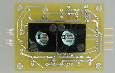 Two photoresistors covered by polarizing film in two orientations.