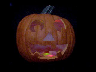 Click to see a movie of a pumpkin with red, green, and blue flashing LEDs.