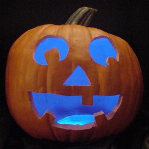 Pumpkin lit with blue LEDs instead of a candle.