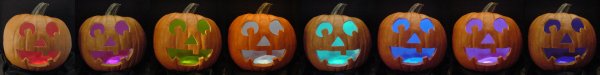 LEDs (light emitting diodes) light up a series of Halloween pumpkins in a rainbow of colors.