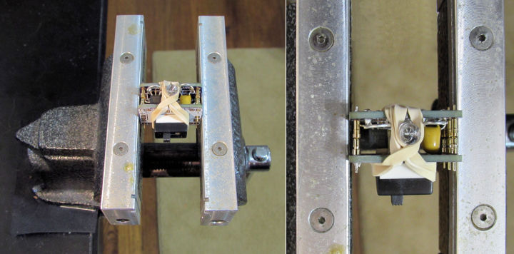 Keep board straight by soldering in vise with rubber bands