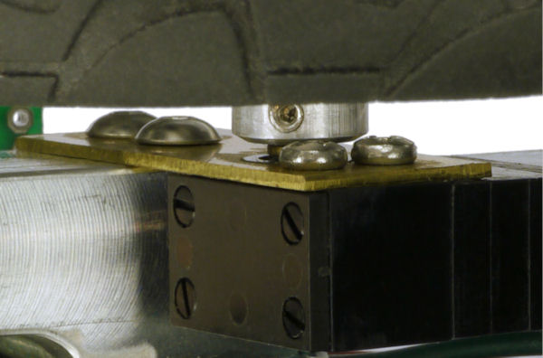 Motor mount made from thin brass sheet due to short shaft and nearby mounting holes