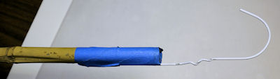 Hook made from coat hanger taped to a bamboo pole