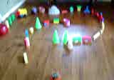 Click to see a movie of Roundabout slowly driving through a perfect maze (one path, no dead ends) made of toys