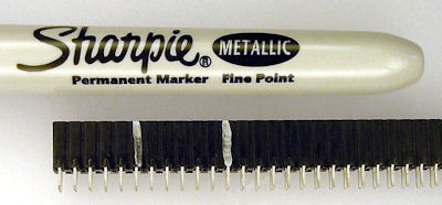 Metallic Sharpie marks cut points in header.