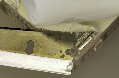 Razor blade attempting to remove double sided sticky tape