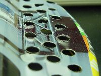 Bare metal exposed with protruding burrs