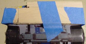 Wood to level the underside during LED and sensor hole drilling