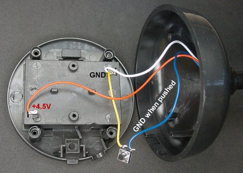 Existing battery-pack and pushbutton wiring in the base.