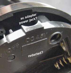 Redacted AC adapter power jack.