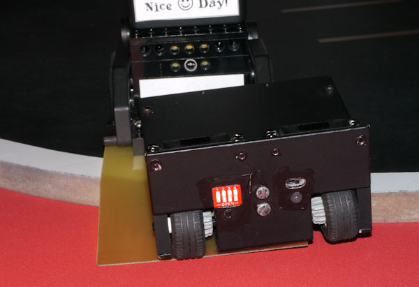 Bent scoop touches ground before the opponent