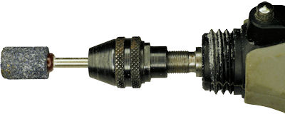 Dremel rotary tool with grinding stone attachment